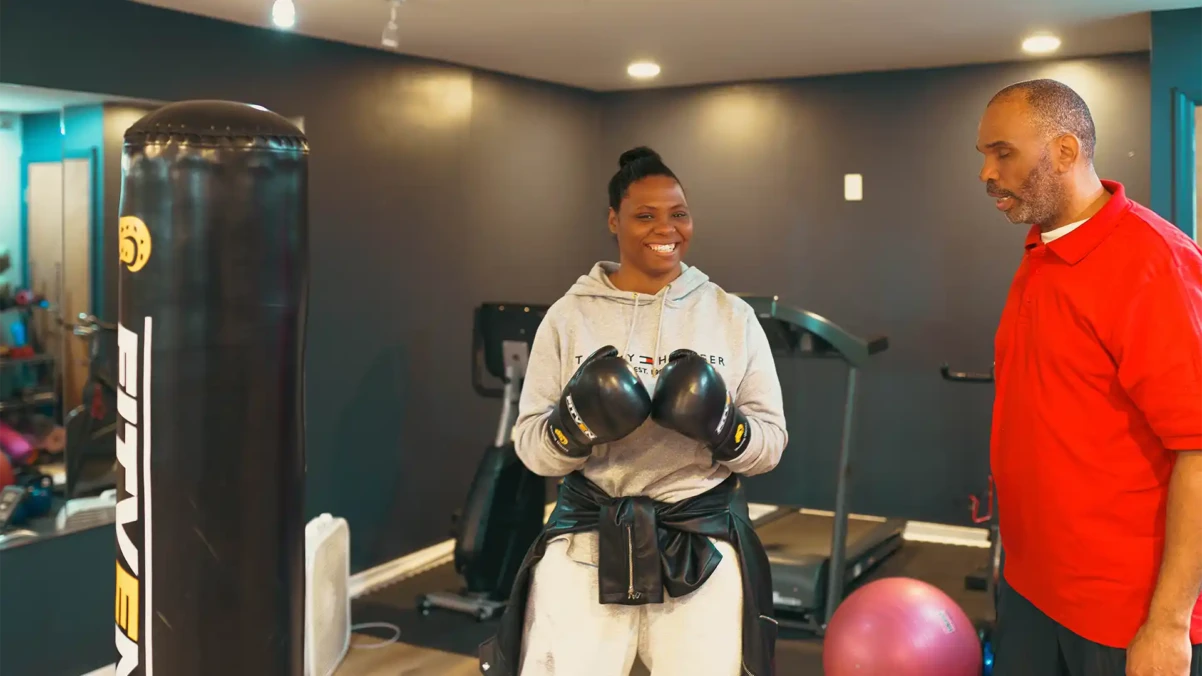 Venture House member with boxing gloves on