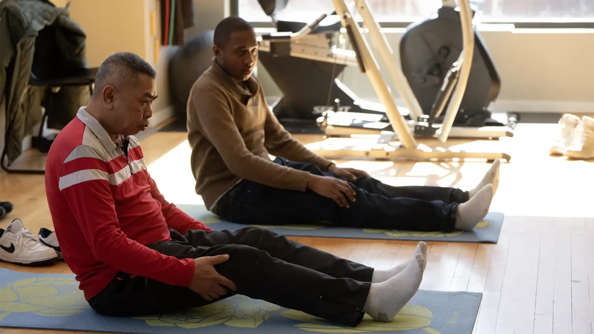 Venture House members doing yoga together