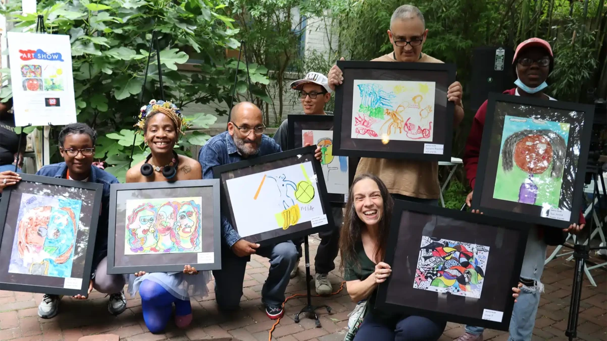 Venture House members showing their art for an art show