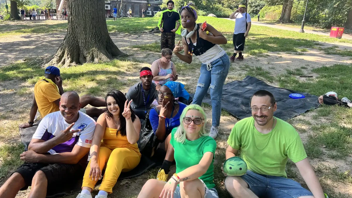 Venture House members sitting together outside